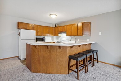 Cozy kitchen is open to the living room.