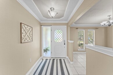 Entry offers enough space for a credenza to displa
