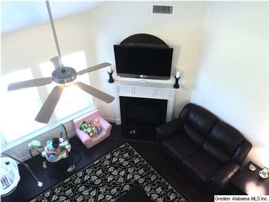 VIEW OF MAIN LEVEL DEN WITH FIREPLACE FROM HUGE LO