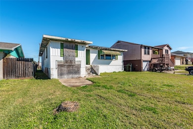 Charming fixer-upper with spacious front yard, off