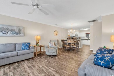 Living room featuring baseboards, visible vents, d