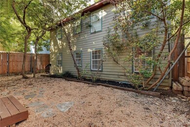 View of side of property with a fenced backyard