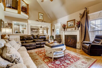 The living area is spacious and features a gas fireplace with vaulted ceilings.  It opens in to the eat in kitchen.  