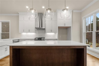 The gorgeous kitchen has tons of countertop an storage space! *Please note that photos shown are representative of the floorplan but are not photos of the actual home available.