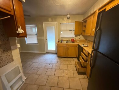 Kitchen with black appliances and sink