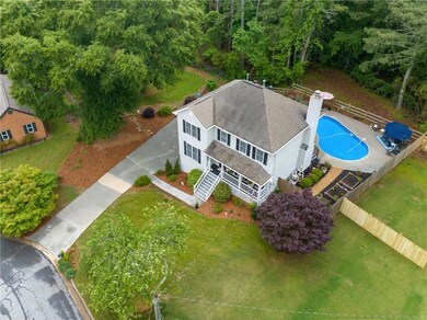 View of subject property featuring a pool