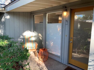 View of exterior entry featuring board and batten siding