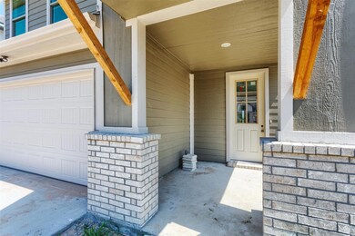 View of exterior entry featuring a garage