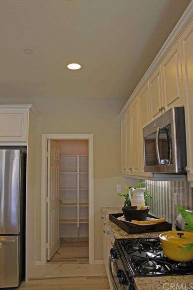 Generous walk in kitchen pantry.  Photo taken of t