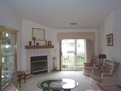 Fireplace - sliders to balcony - vaulted ceilings 