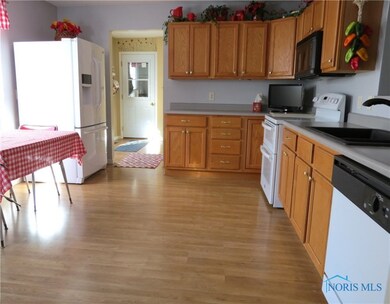 Kitchen with view through the utility to garage.
