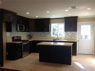 New Kitchen with door leading to the backyard.