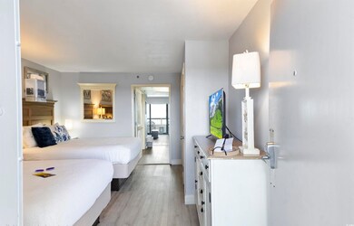 Bedroom with light wood-type flooring and baseboards