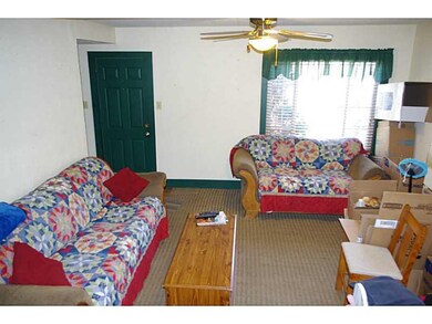 Living Room. Living room features wall to wall car