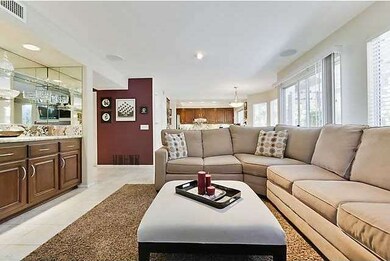 FAMILY ROOM WITH UPGRADED WET BAR FEATURING CUSTOM