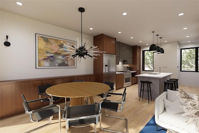 Dining space featuring light wood-style flooring, recessed lighting, a chandelier, and wainscoting