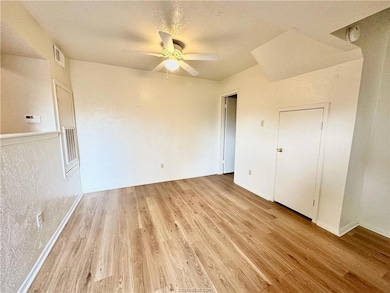 Unfurnished bedroom with a textured ceiling, light