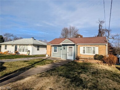 Ranch-style house with a front lawn