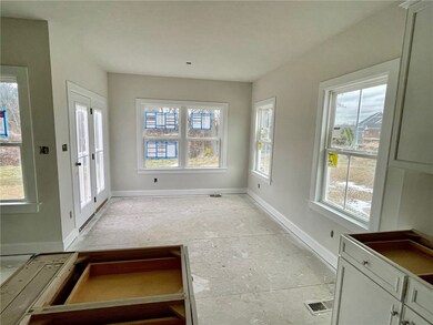 MORNING ROOM WITH PATIO DOOR LEADING TO BACK YARD.