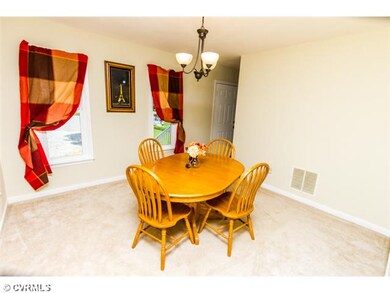 Dining Room - Formal dining room has been freshly 