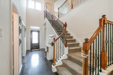 A gracious, centrally located staircase provides ease of access to this to both floors of this exceptional home noting architectural niches.