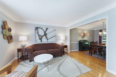 The living room opens to the formal dining room, p
