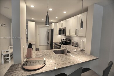 470 Paradise Isle Blvd unit 107, Hallandale Beach, FL 33009 - photo 4