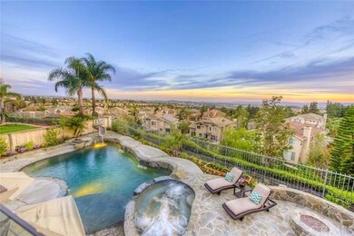 Beautiful Pebble Tec pool and spa with stone patio