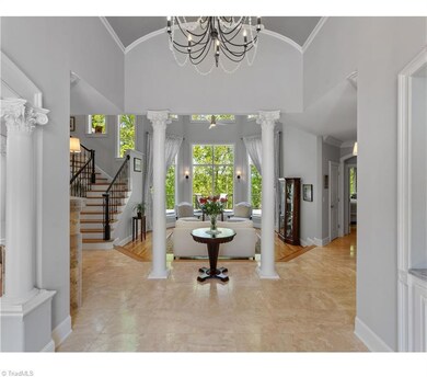 Beautiful entry with a stunning view of the woods behind