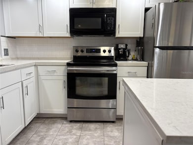 2420 Winding Creek Blvd unit 101, Clearwater, FL 33761 - photo 3