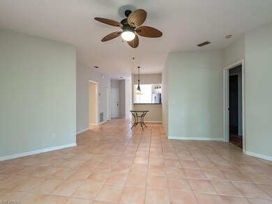 Tiled spare room with ceiling fan