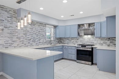 Kitchen with gas stove, extractor fan, hanging lig
