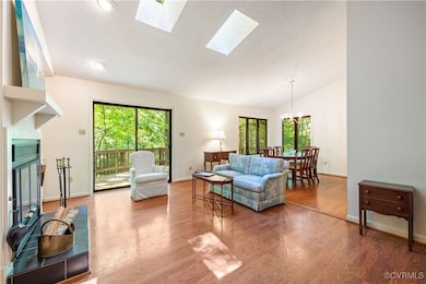 Open floor plan with sliding glass door to deck.
