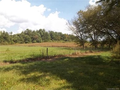 Looking from neighbors field into subject property