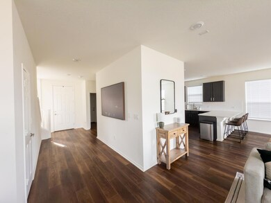 Corridor with dark wood-style flooring