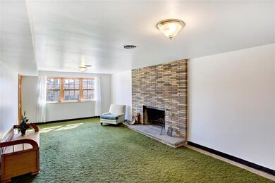 Game room with wood burning fireplace