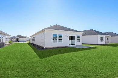 Rear view of property with a lawn, cooling unit, a