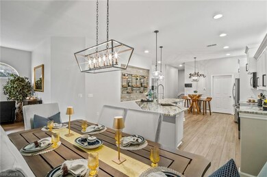 Dining space with a chandelier, recessed lighting, and light wood finished floors