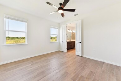 Unfurnished bedroom featuring visible vents, base