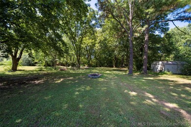 Complete with storage shed, this acre is ready for