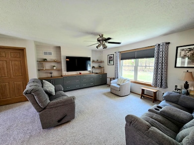 CUSTOM BUILT CABINET IN LIVING ROOM