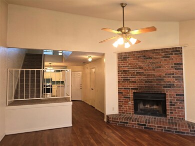 Wood-burning fireplace in living room.