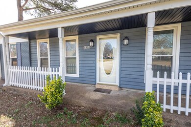 Property entrance featuring a porch and fence