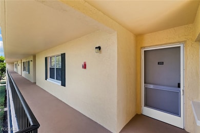 View of exterior entry featuring stucco siding