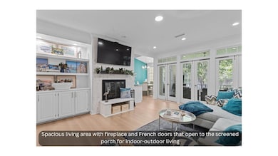 Living area with Crown molding, french doors,LVP floors, a fireplace, and recessed lighting