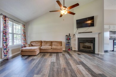 Fireplace and new ceiling fan.