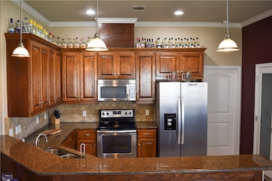 Kitchen featuring stainless steel appliances, gran