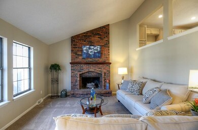 Bright Open living room with lovely fireplace