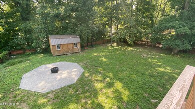 FENCED BACK YARD W/ FIRE PIT & SHED