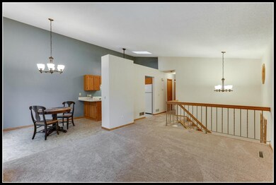 Living room opens to eat-in kitchen
